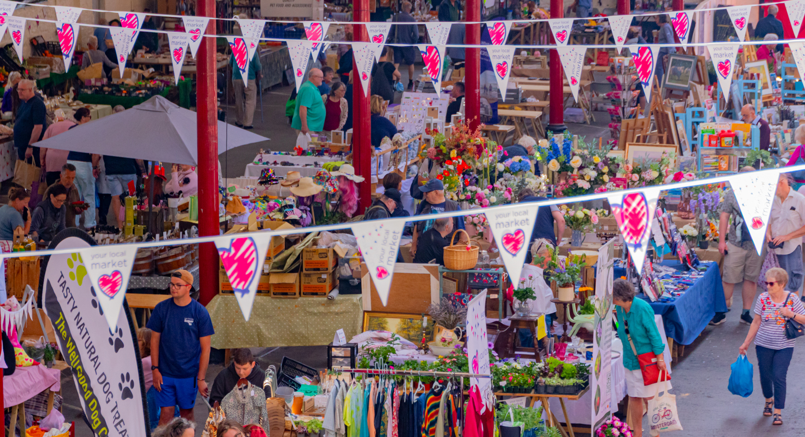 Visitors browsing the indoor Pannier Market