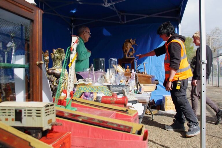 A vintage and collectables stall beneath an outdoor gazebo